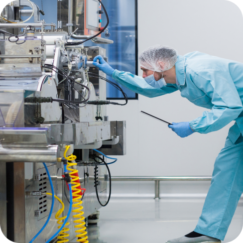 Biopharma clinician calibrating CDMO machine